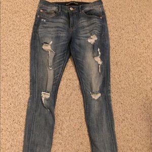 Distressed express skinny jeans
